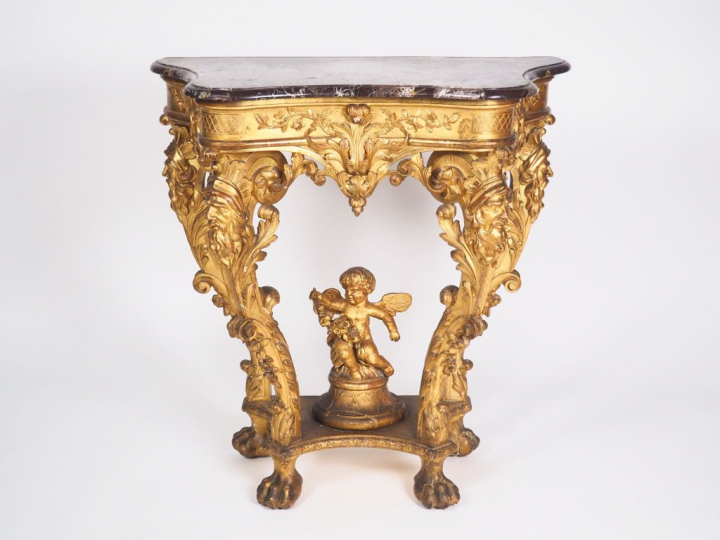 Console de style Louis XIV en bois sculpté et doré, quatre pieds à déc
