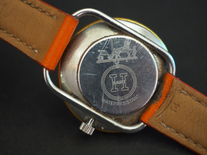 HERMES Montre bracelet de dame en acier, modèle arceau.  Cadran paille