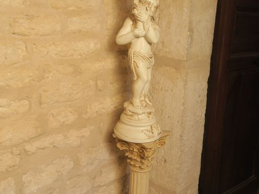 Lampe en forme de nubien porte torchère en composition. une colonne en