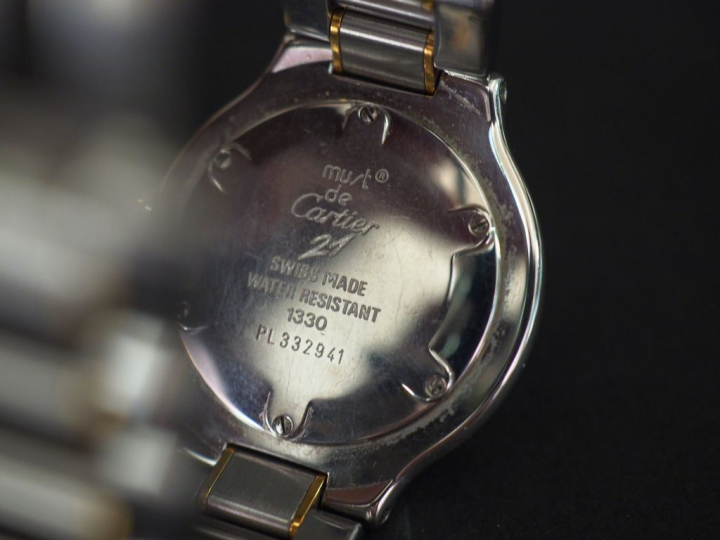 CARTIER, Must 21 Montre bracelet de dame en acier et métal doré.  Cadr