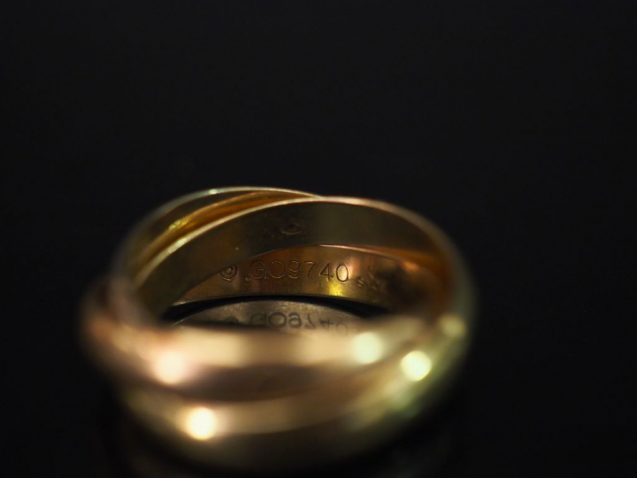 CARTIER, Trinity  Bague trois anneaux en or de trois couleurs.  Signée