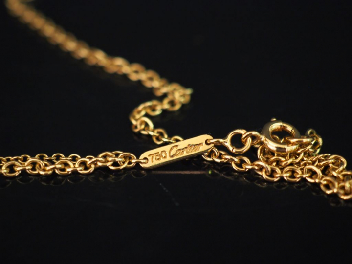 CARTIER, Trinity Collier en or jaune, maille forçat, et son pendentif 