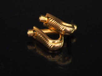 Vente aux enchères Paire de boutons de manchettes en or jaune, à décor de godrons.  Poids
