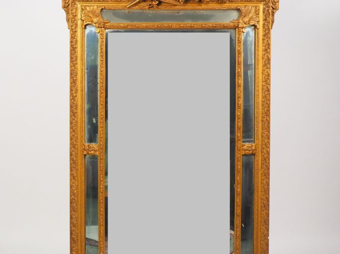 Grand miroir à parecloses fin XIXème de style Louis XVI en bois et stu