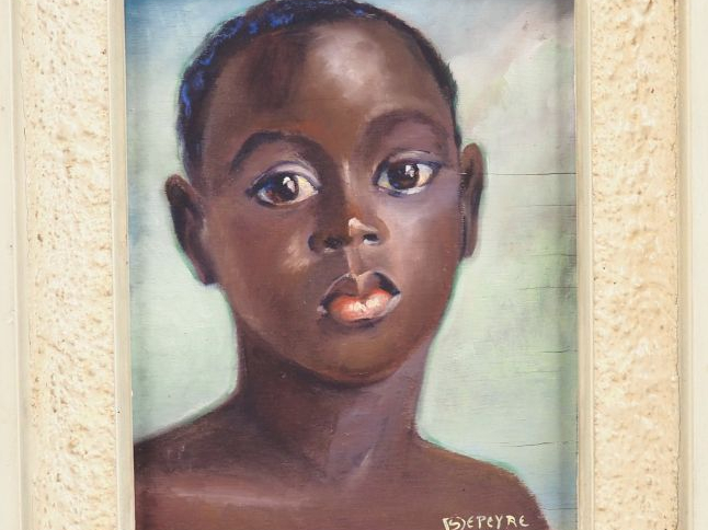 S. DESPEYRE.   "Portrait de jeune africaine". Huile sur panneau, signé