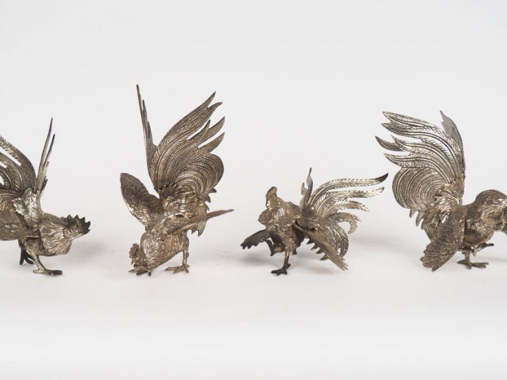 4 coqs de de bruyère en métal argenté.