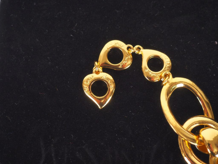 YVES SAINT LAURENT. Collier articulé en métal doré à large maille fant