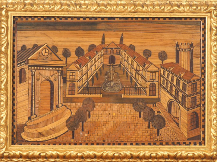Tableau en marqueterie de paille à décor de château. Dim (à vue) : 17 