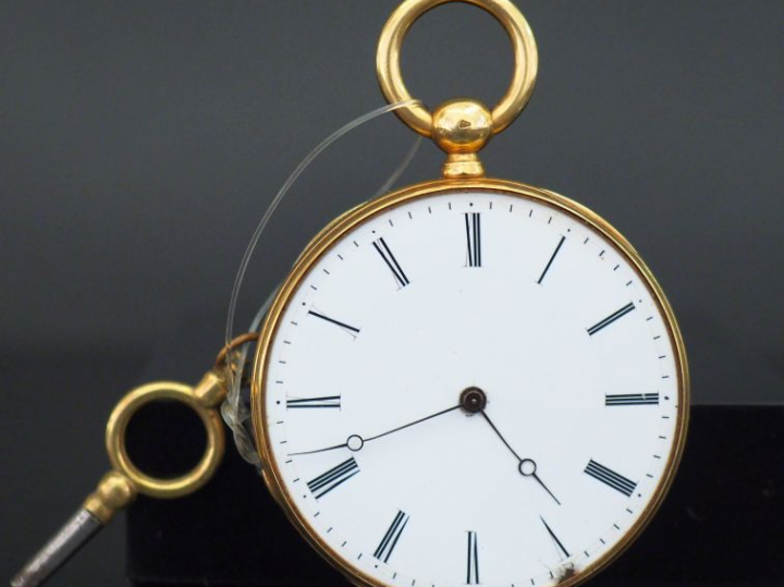Montre de gousset en or jaune.  Cadran à chiffres romains pour les heu