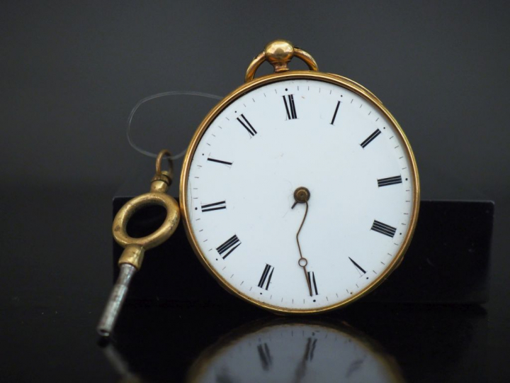 Montre de gousset en or jaune.  Cadran à chiffres romains pour les heu