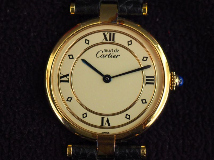 CARTIER, Must Montre bracelet en vermeil.  Cadran rond à chiffres roma