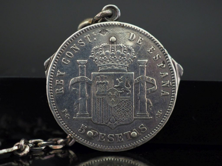 Une pièce de 5 Pesetas en argent, transformée en couteau suisse.  Poid