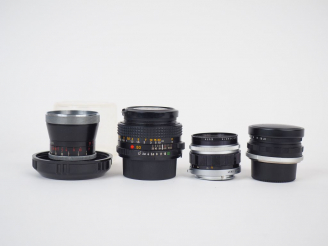 Vente aux enchères Lot de quatre objectifs :  - OLYMPUS F=38 mm/1:2,8 n°108700  - VOIGTLA