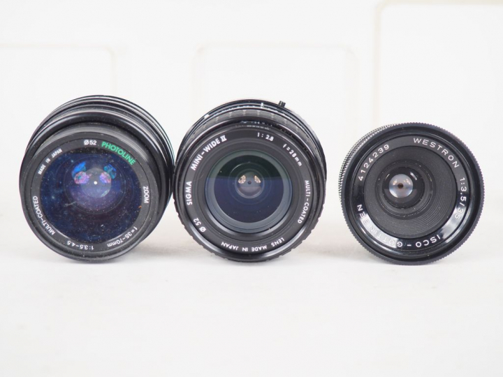 Lot de onze différents objectifs dont CANON, SIGMA, PENTAX, ISCO, PENT