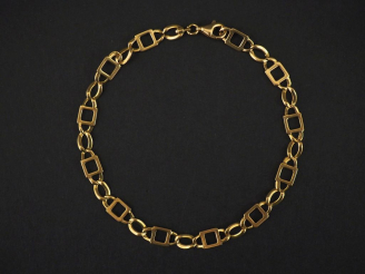 Vente aux enchères Bracelet souple en or jaune, maille fantaisie.  Long. 20 cm Poids. 6,5