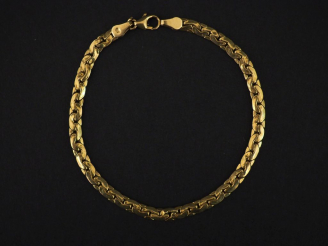 Vente aux enchères Bracelet articulé en or jaune, maille haricot.  Long. 18,5 cm Poids. 4