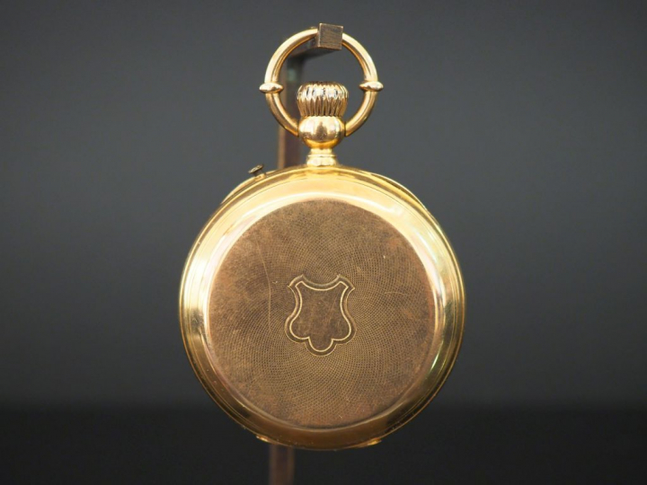 Montre de gousset en or jaune.  Cadran à chiffres romains pour les heu