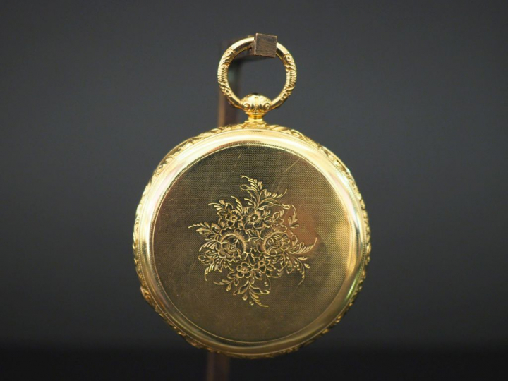 Montre de gousset en or jaune.  Cadran à chiffres romains pour les heu