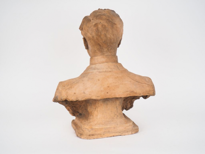 POUGENS.  "portrait de jeune homme en buste". Sculpture en terre cuite