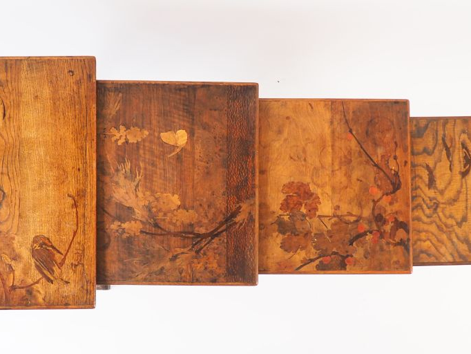 GALLE.  Suite de quatre tables gigognes en marqueterie à décor d'oisea
