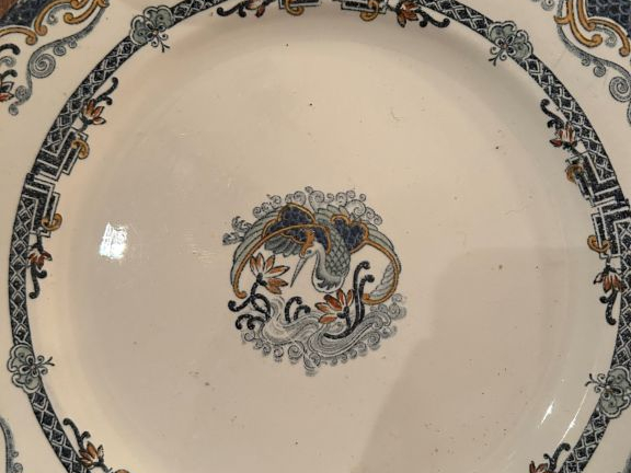 12 assiettes en faïence fine fin XIXème à décor de cigognes ensemble d