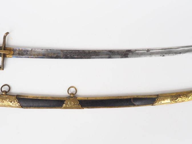 Joli sabre d’officier à pieds révolution Empire. Lame courbe à la Mont