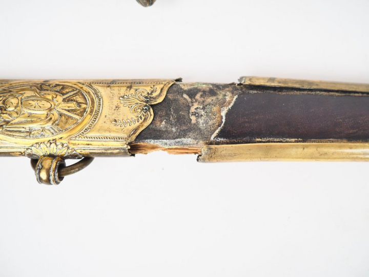 Joli sabre d’officier à pieds révolution Empire. Lame courbe à la Mont