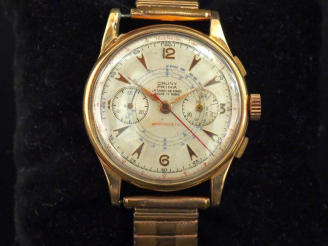 Vente aux enchères CAUNY PRIMA, La Chaux-De-Fonds. Montre d'homme, boitier rond en or jau