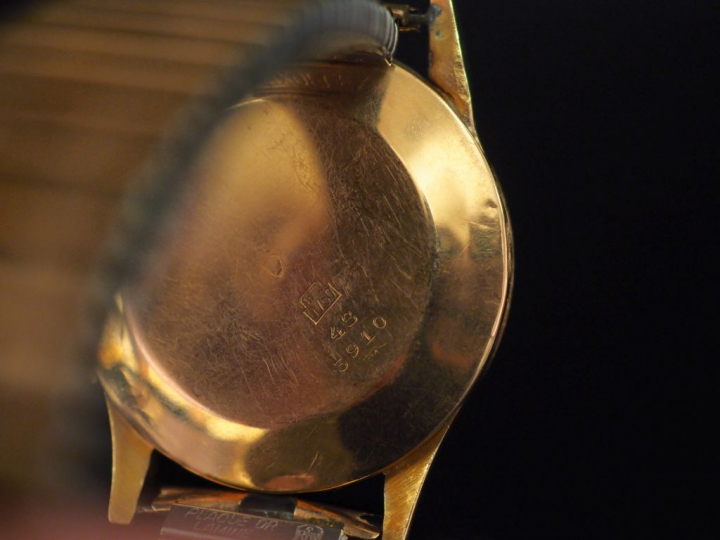 CAUNY PRIMA, La Chaux-De-Fonds. Montre d'homme, boitier rond en or jau