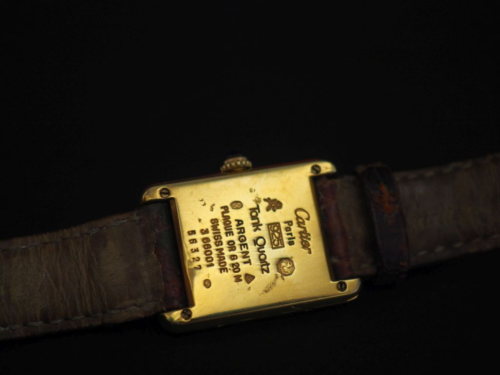 CARTIER, Must Montre bracelet de dame, modèle "Tank". Cadran rectangul