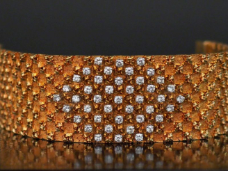 Vente aux enchères Bracelet manchette souple en or jaune 750 et platine 950, maille plate