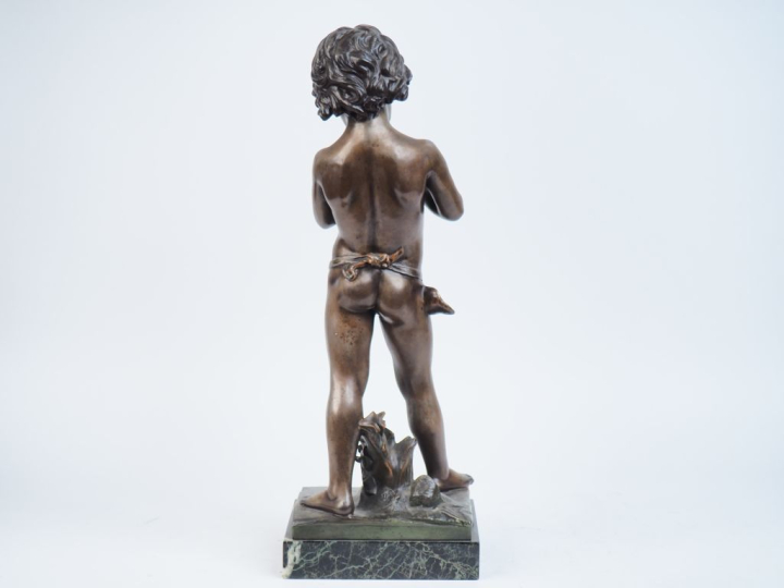 GREGOIRE. "l'enfant charmeur de lézard". Sculpture en régule patiné su