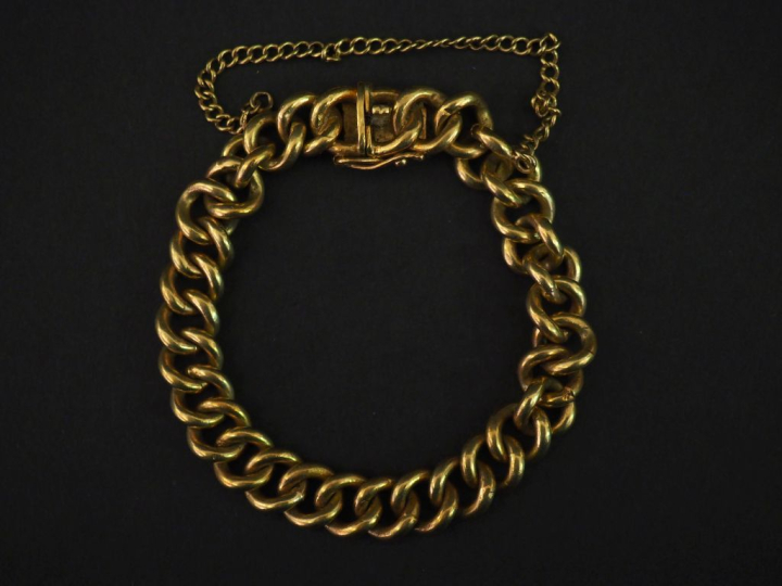 Bracelet souple en or jaune 750, maille gourmette.  Chainette de sécur