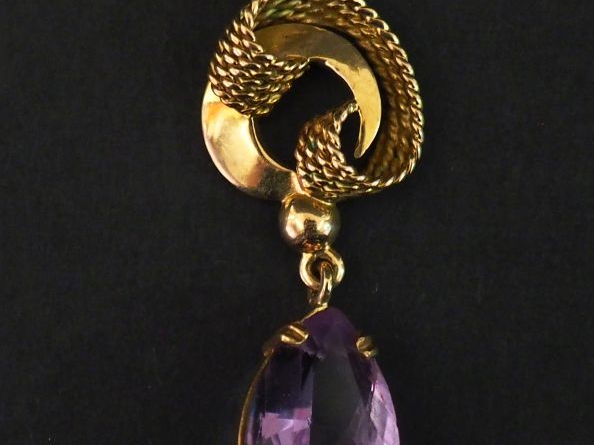 Pendentif de forme stylisée en or jaune 585, agrémenté d'une pendeloqu