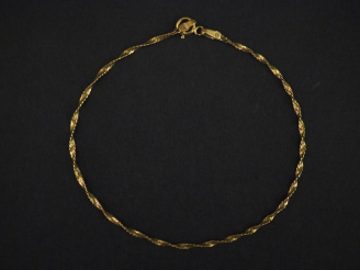 Vente aux enchères Bracelet souple en or jaune 750, maille torsadée.  Long. 18,5 cm Poids