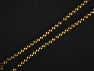 Vente aux enchères Bracelet souple en or jaune 750, à décor de rang de perles.  Long. 18,