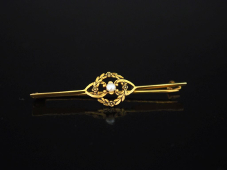 Vente aux enchères Broche barrette de style Louis XVI en or jaune 750, à décor ajouré en 
