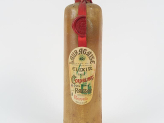 Vente aux enchères 1 VIEILLE BOUTEILLE LAURAGAISE ELIXIR DES CORDELIERS RAISSAC