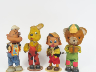 Vente aux enchères 	Lot de jouets mécaniques des années 60 en plastique et peluche en éta