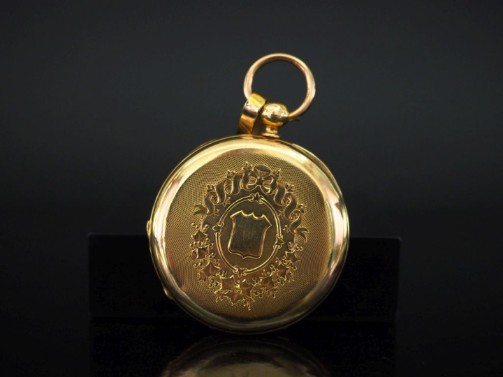Montre de gousset en or jaune 750.  Cadran émaillé à chiffres romains 