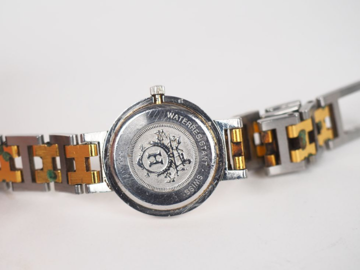 HERMES, Paris Montre bracelet, modèle Clipper, en acier et acier doré.