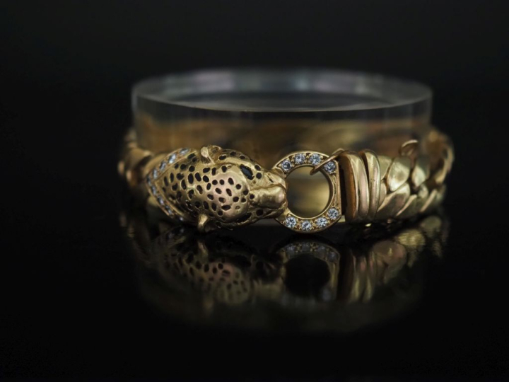 Bracelet souple en or jaune 750, maille américaine, à décor d'une tête