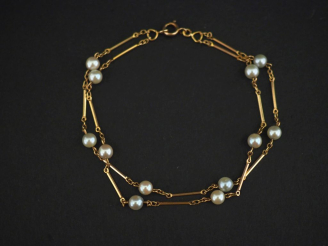 Vente aux enchères Bracelet souple double rangs en or jaune 750, à décor de maillons rect