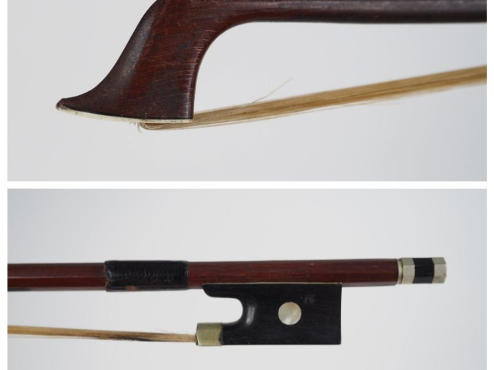 147-Archet 	de violon en bois d'abeille signé Tourte. 	vers 1920 	4/4 