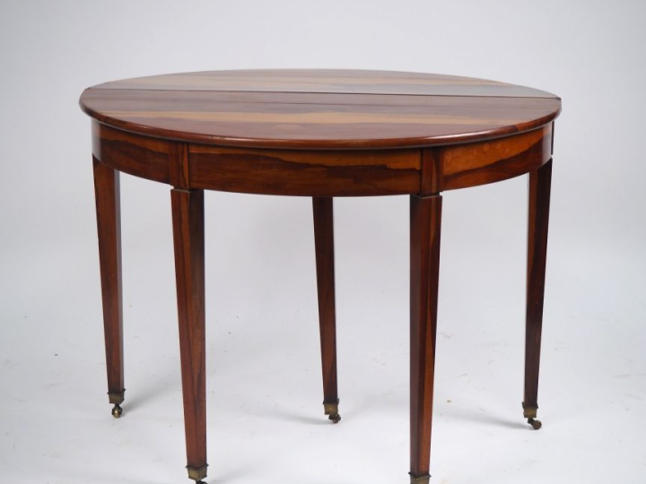 Table demi lune début XIXème en bois exotique, plateau circulaire à ab