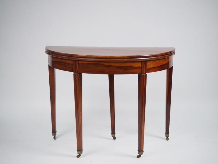 Table demi lune début XIXème en bois exotique, plateau circulaire à ab
