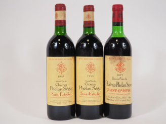 Vente aux enchères 3 BOUTEILLES CHÂTEAU PHÉLAN SÉGUR ST ESTÈPHE : 2 de 1988 LB - 1 de 197