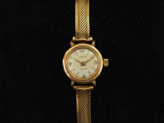 Vente aux enchères LAICA Montre bracelet de dame, boitier et bracelet en or jaune 750.  C