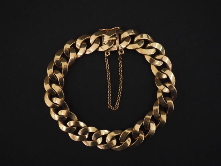 Bracelet souple en or jaune 750, maille gourmette.  Chainette de sécur