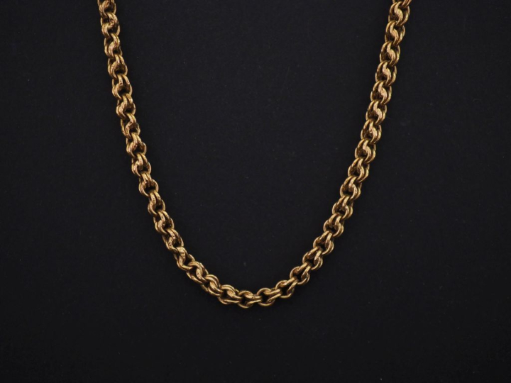 Collier souple en or jaune 750, maille ronde tressée.  Long. 49 cm Poi